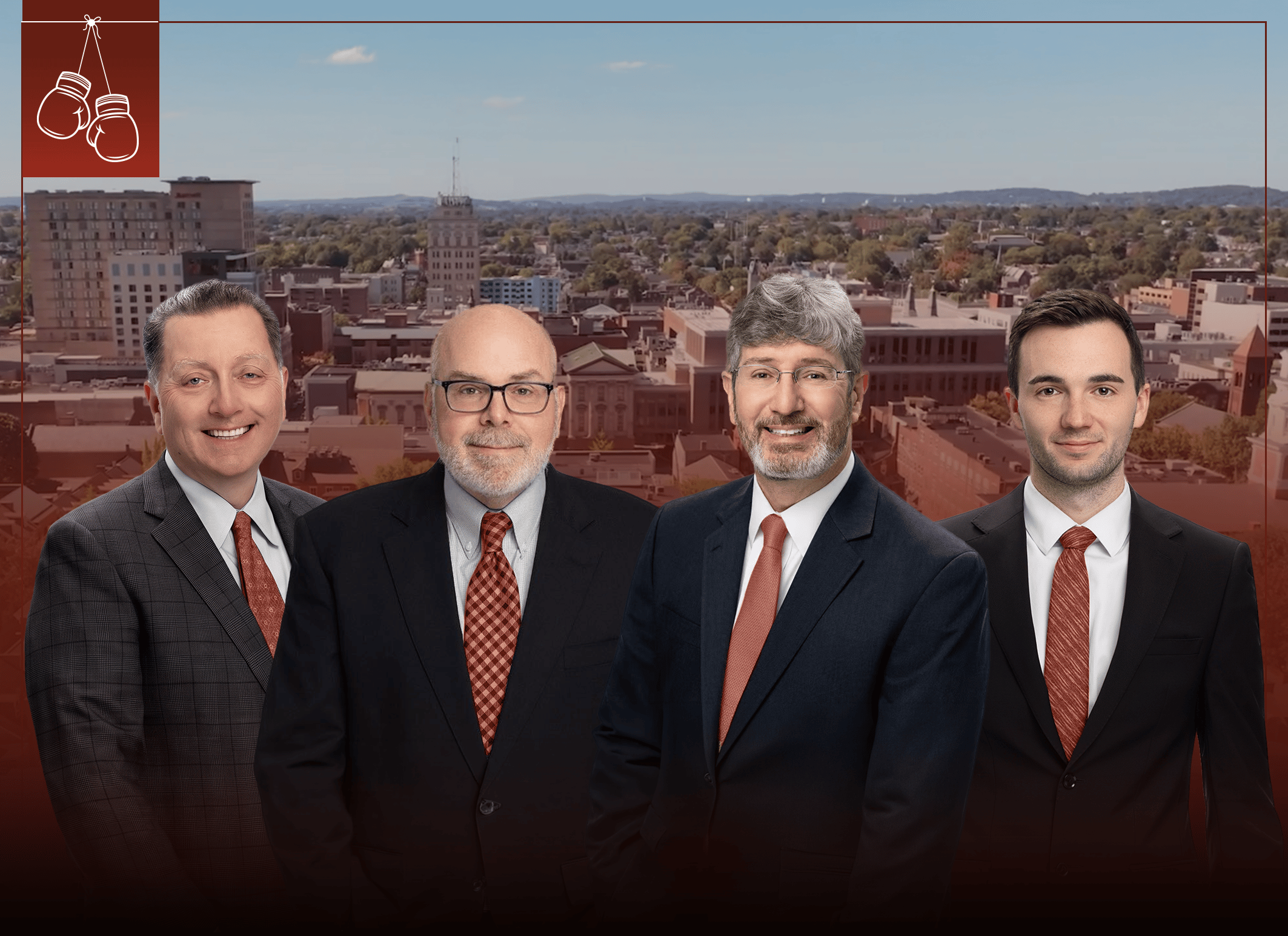 Four Lieber Hyman Potter attorneys in dark suits standing in front of an aerial view of the city