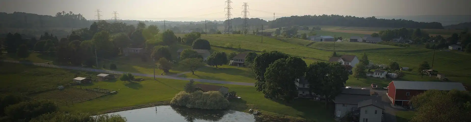 A photo of a rural area in Lebanon, Pennsylvania, with several homes and powerlines in the background.