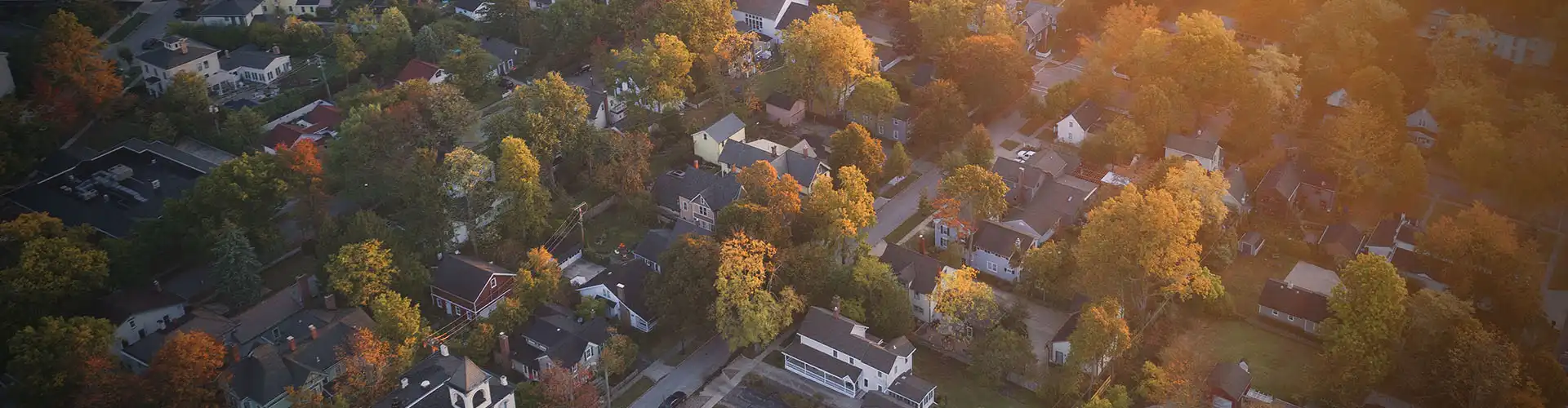 A bird's eye view of Pottstown, Pennsylvania with the sun shining during a sunrise.